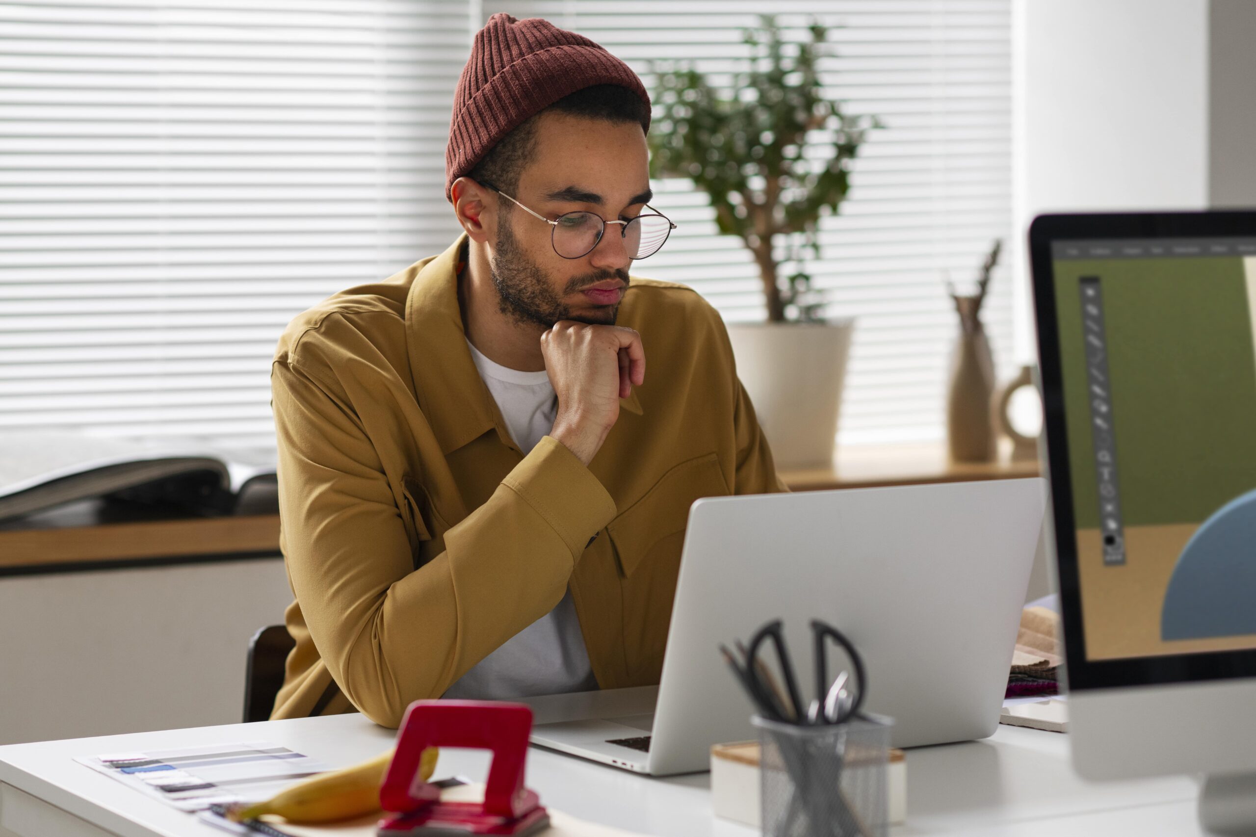 man looking on laptop